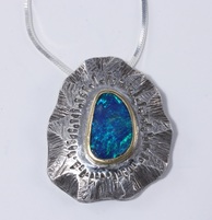 Custom Jewelry Pendant with black opal, silver, and gold